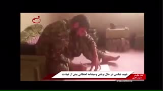 شهید بلباسی در حال نوشتن وصیت نامه لحظاتی پیش از شهادت