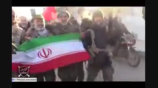 پرچم ایران اسلامی در دست مدافعان حرم در نبل و الزهرا